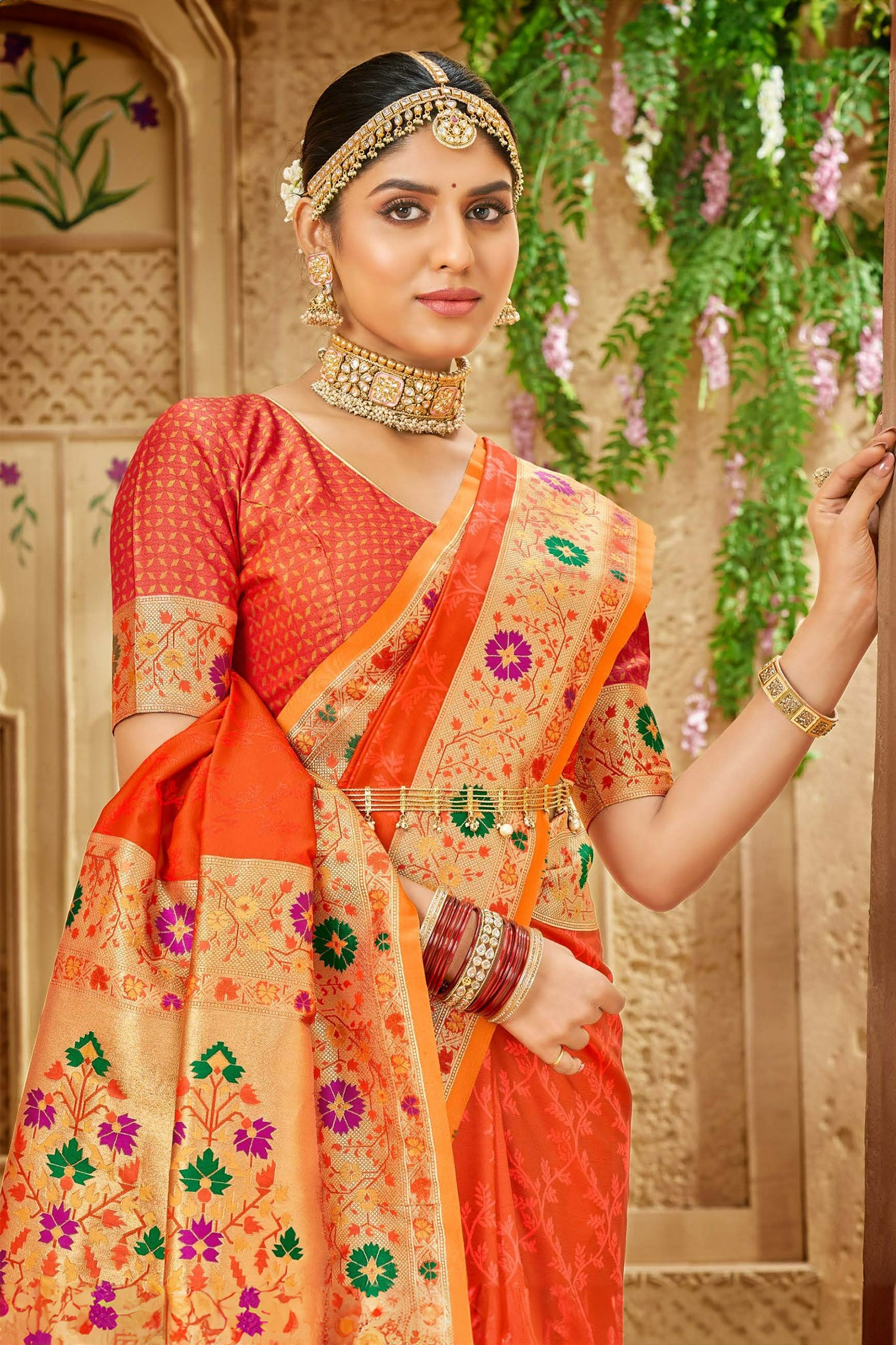 Orange Satin Saree With Green And Purple Meenakari