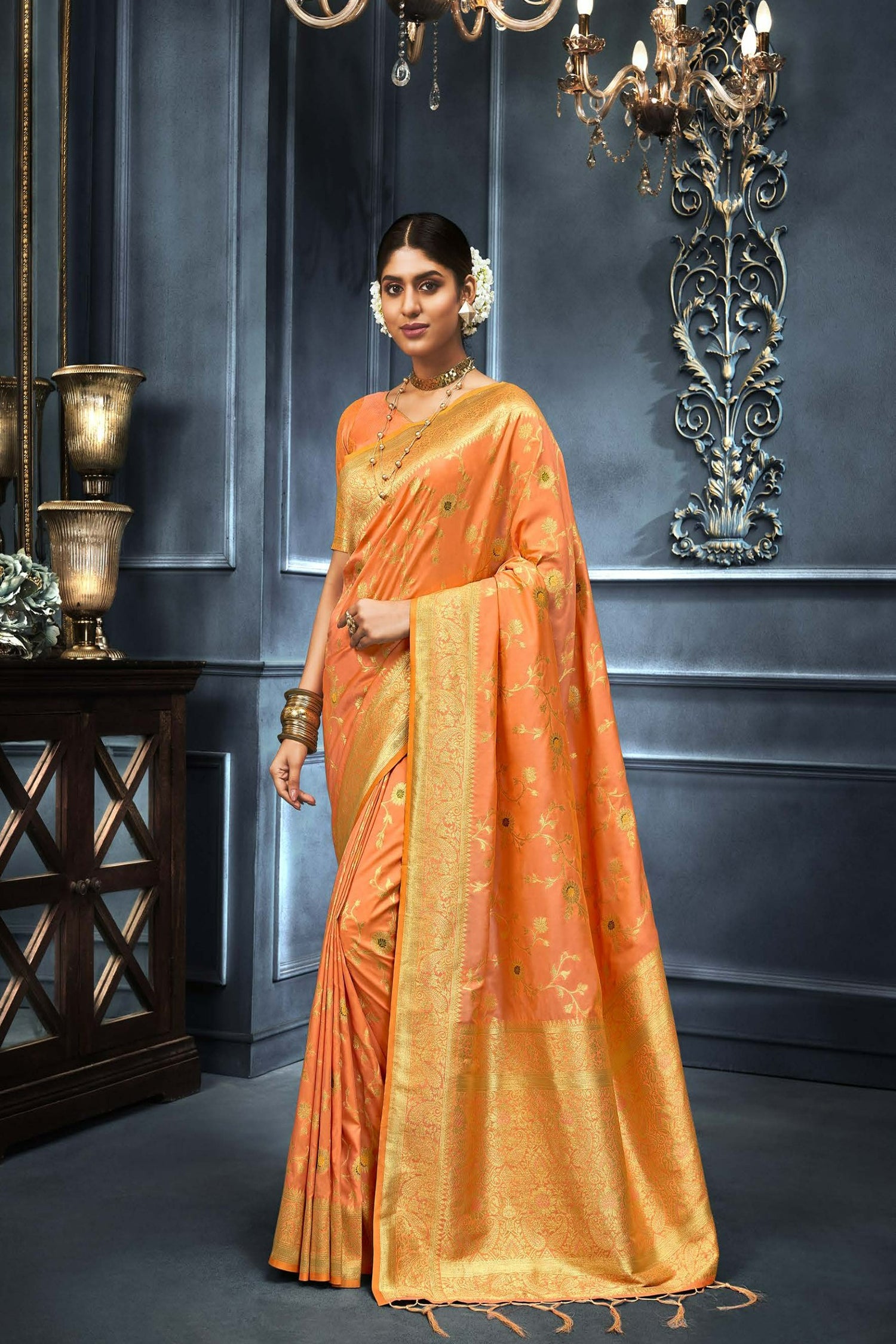 Vibrant Orange Saree With Floral And Paisley Motifs