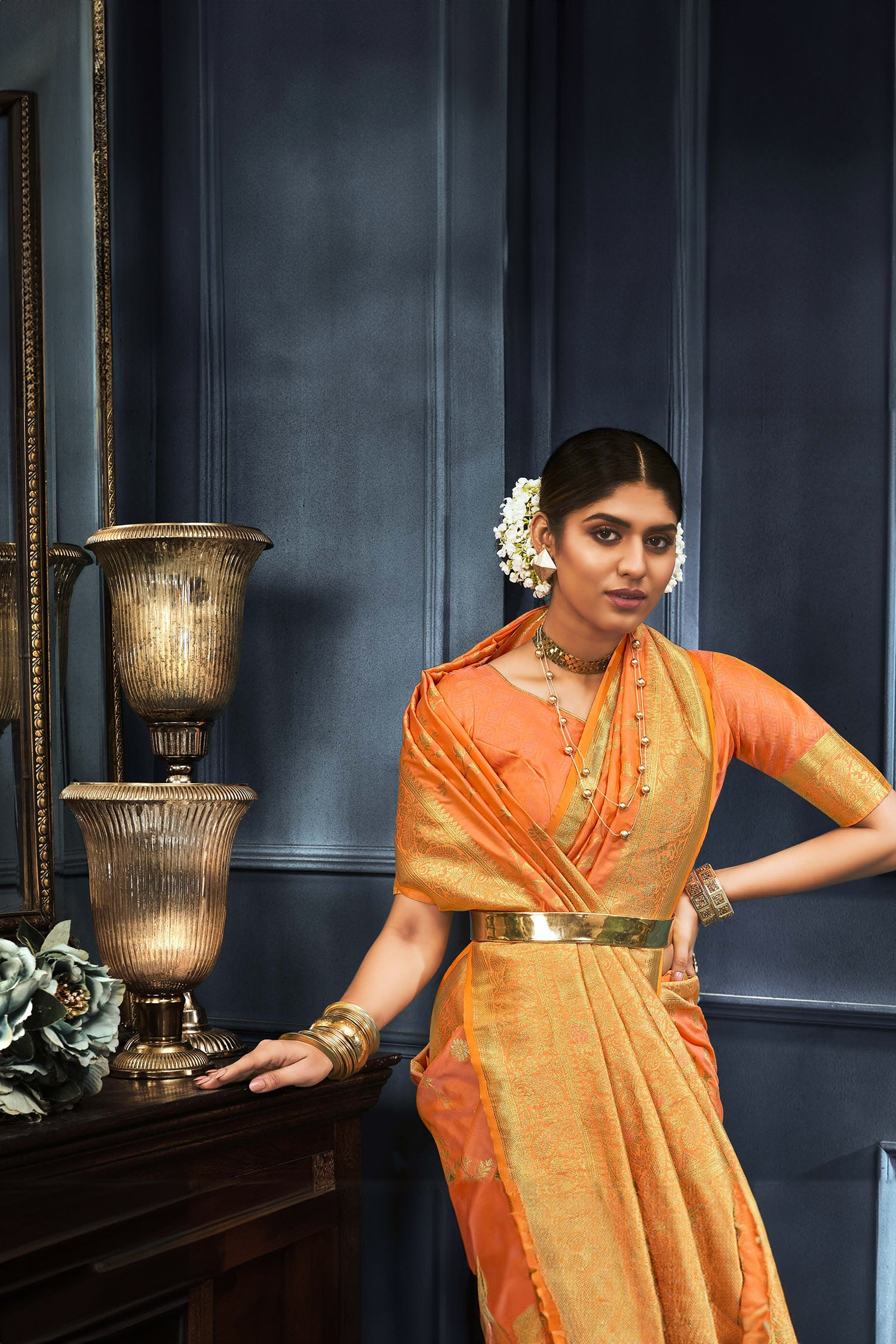 Vibrant Orange Saree With Floral And Paisley Motifs