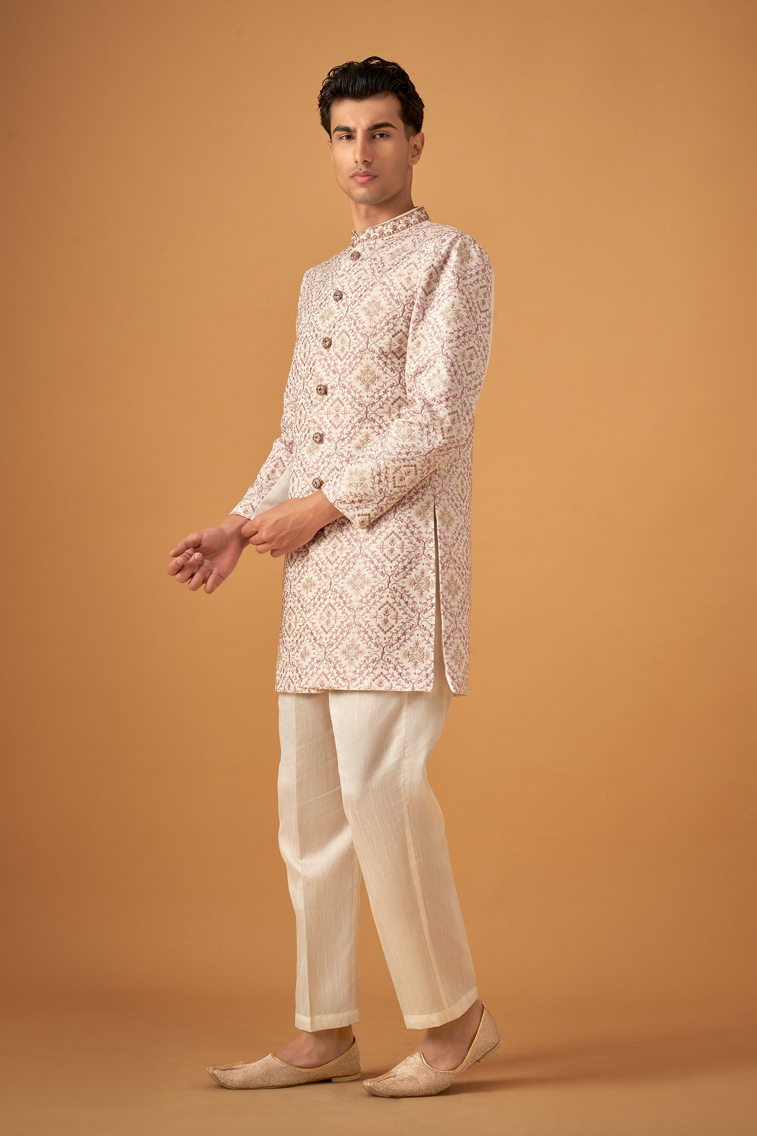 Ivory White Sherwani With Intricate Embroidery Work And Decorative Buttons