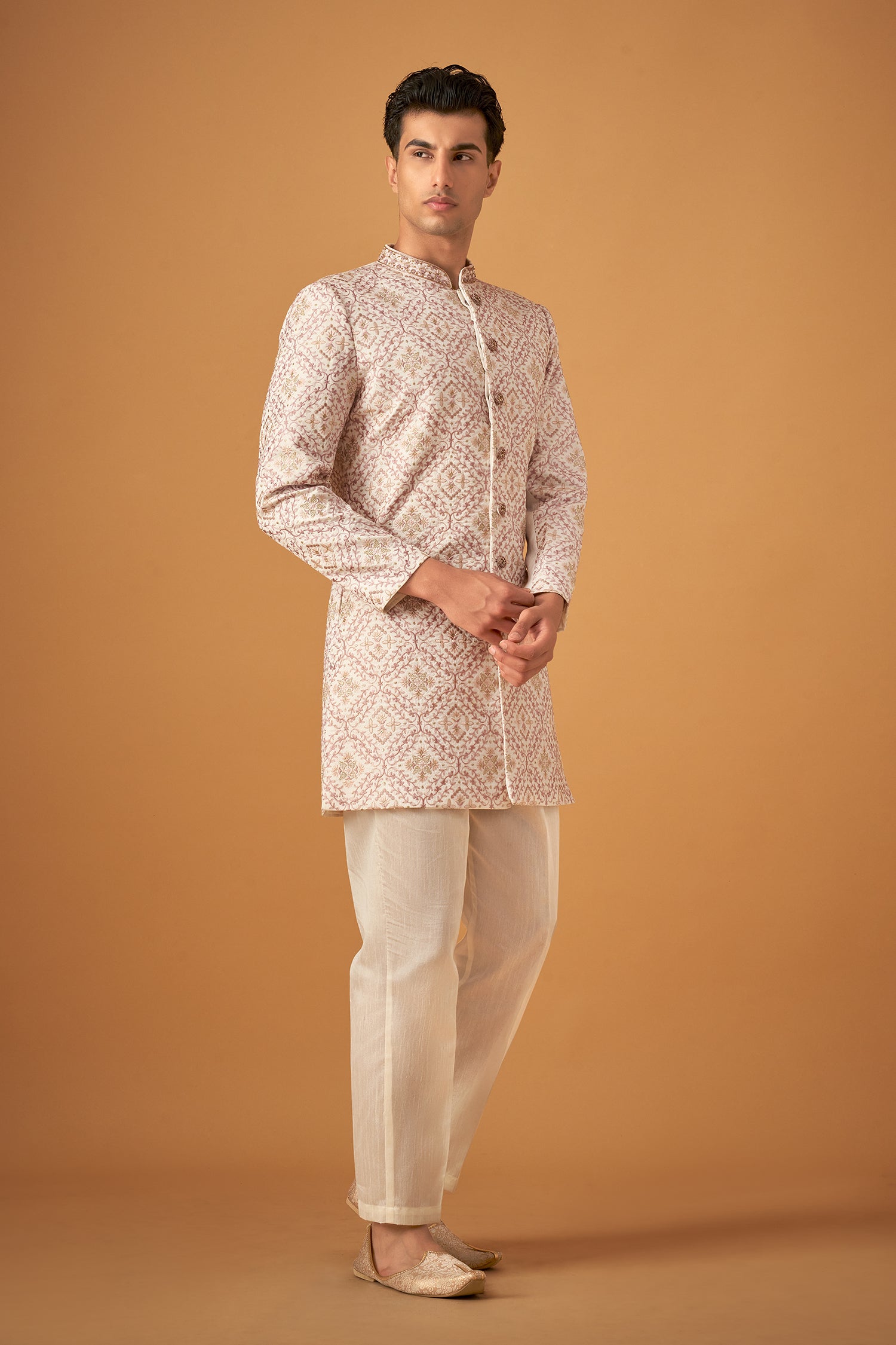 Ivory White Sherwani With Intricate Embroidery Work And Decorative Buttons