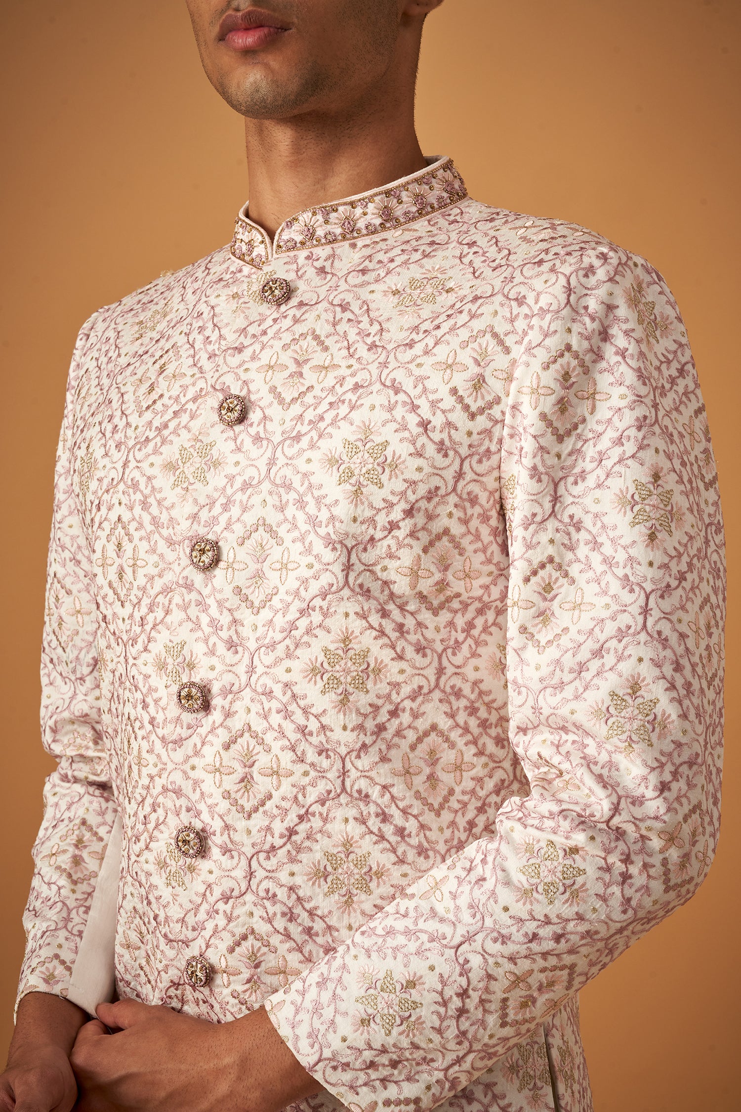 Ivory White Sherwani With Intricate Embroidery Work And Decorative Buttons