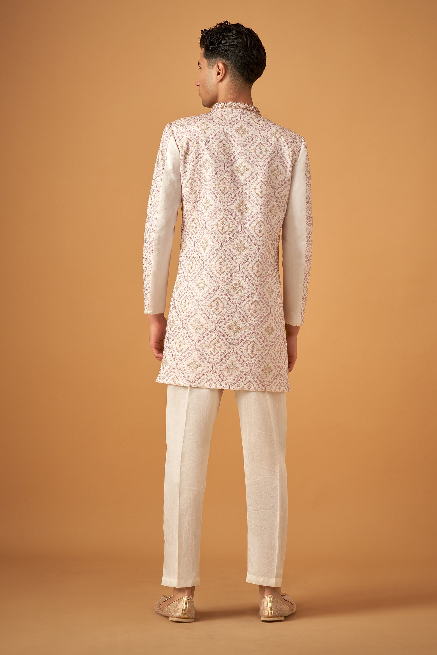 Ivory White Sherwani With Intricate Embroidery Work And Decorative Buttons