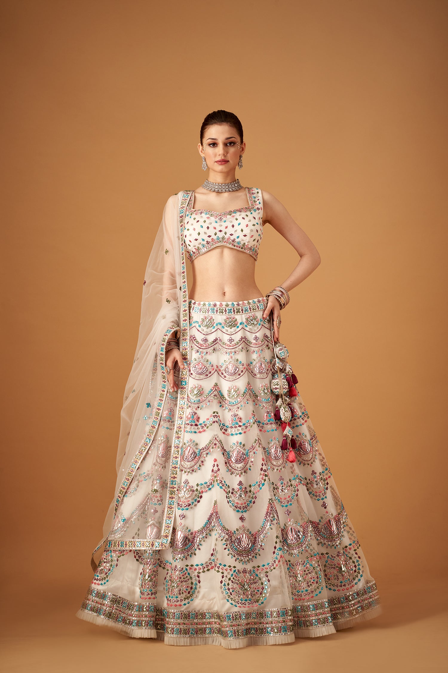 White Lehenga Set With Multicolor Embroidery And Silver Foil Embellishments