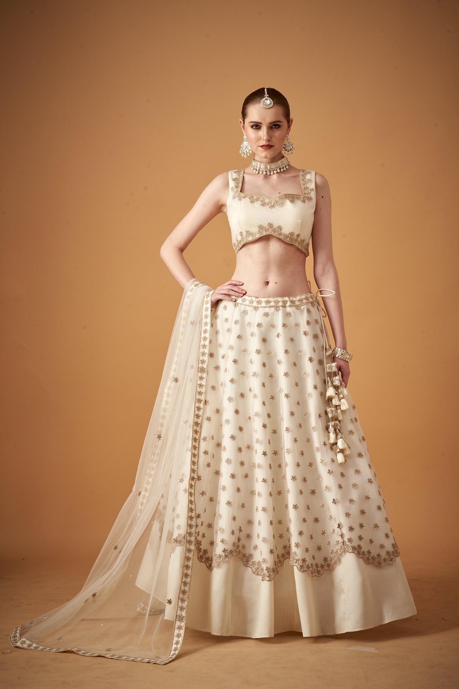 White Lehenga Set With Golden Zari Embellishments