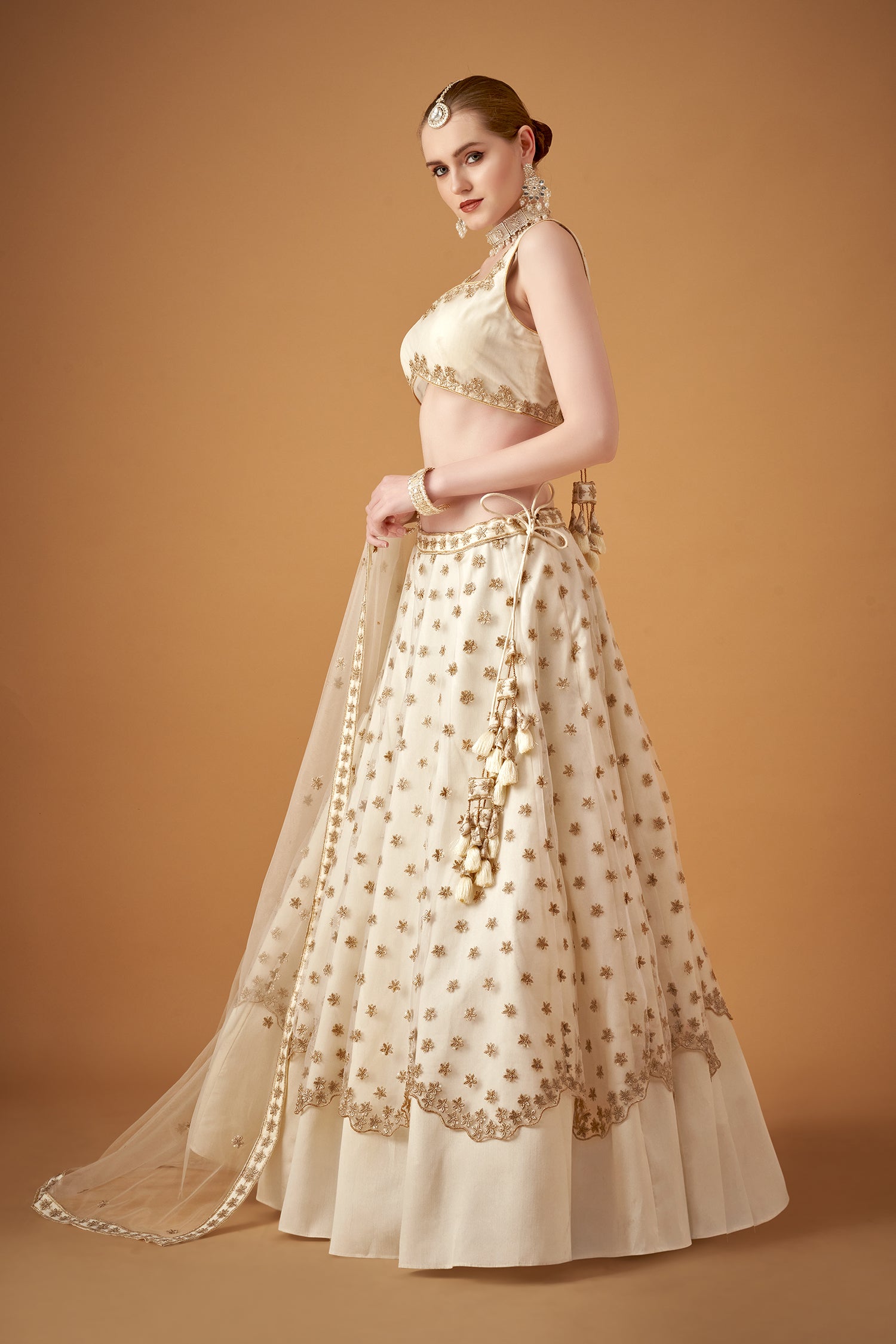 White Lehenga Set With Golden Zari Embellishments