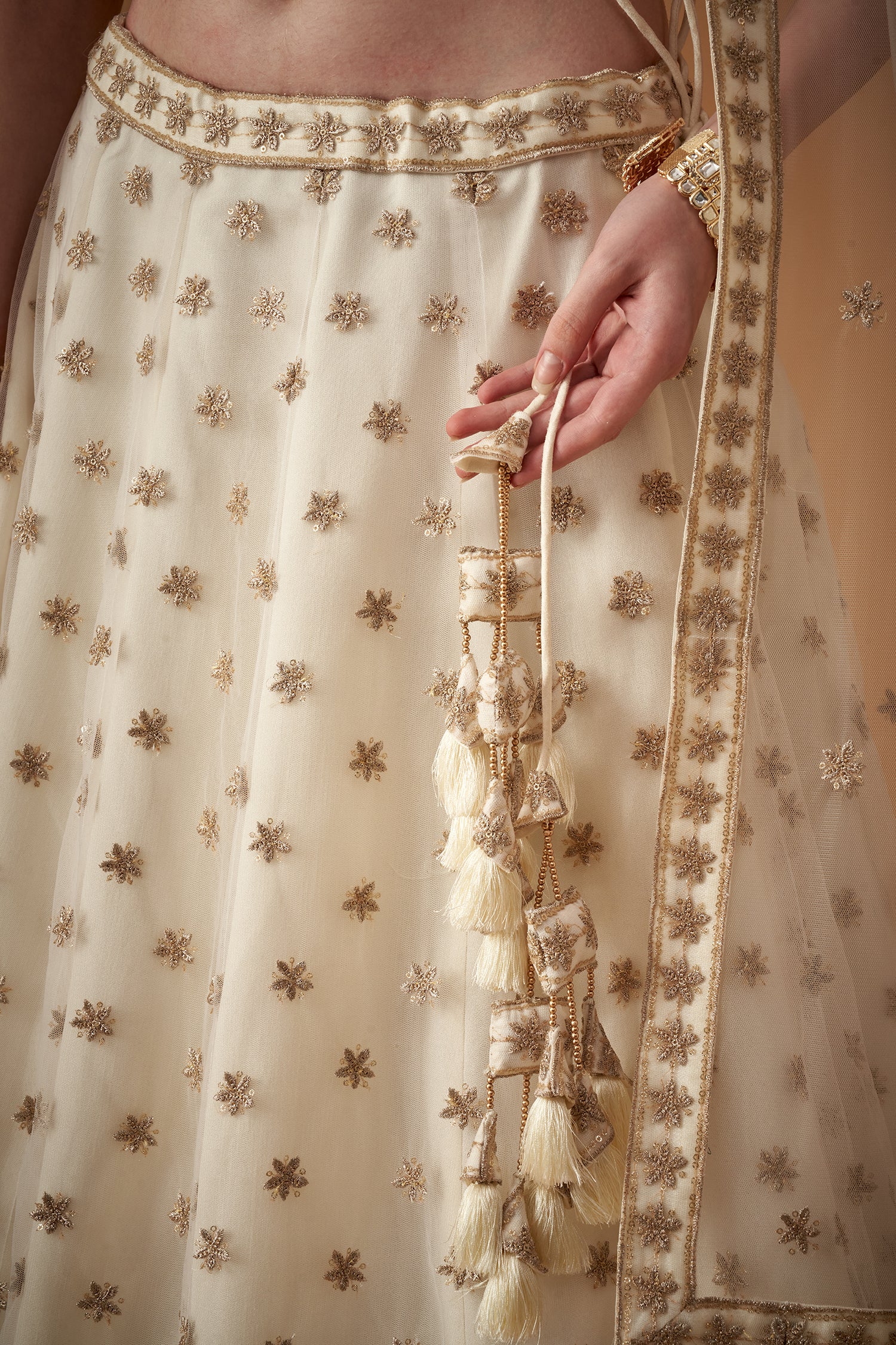 White Lehenga Set With Golden Zari Embellishments