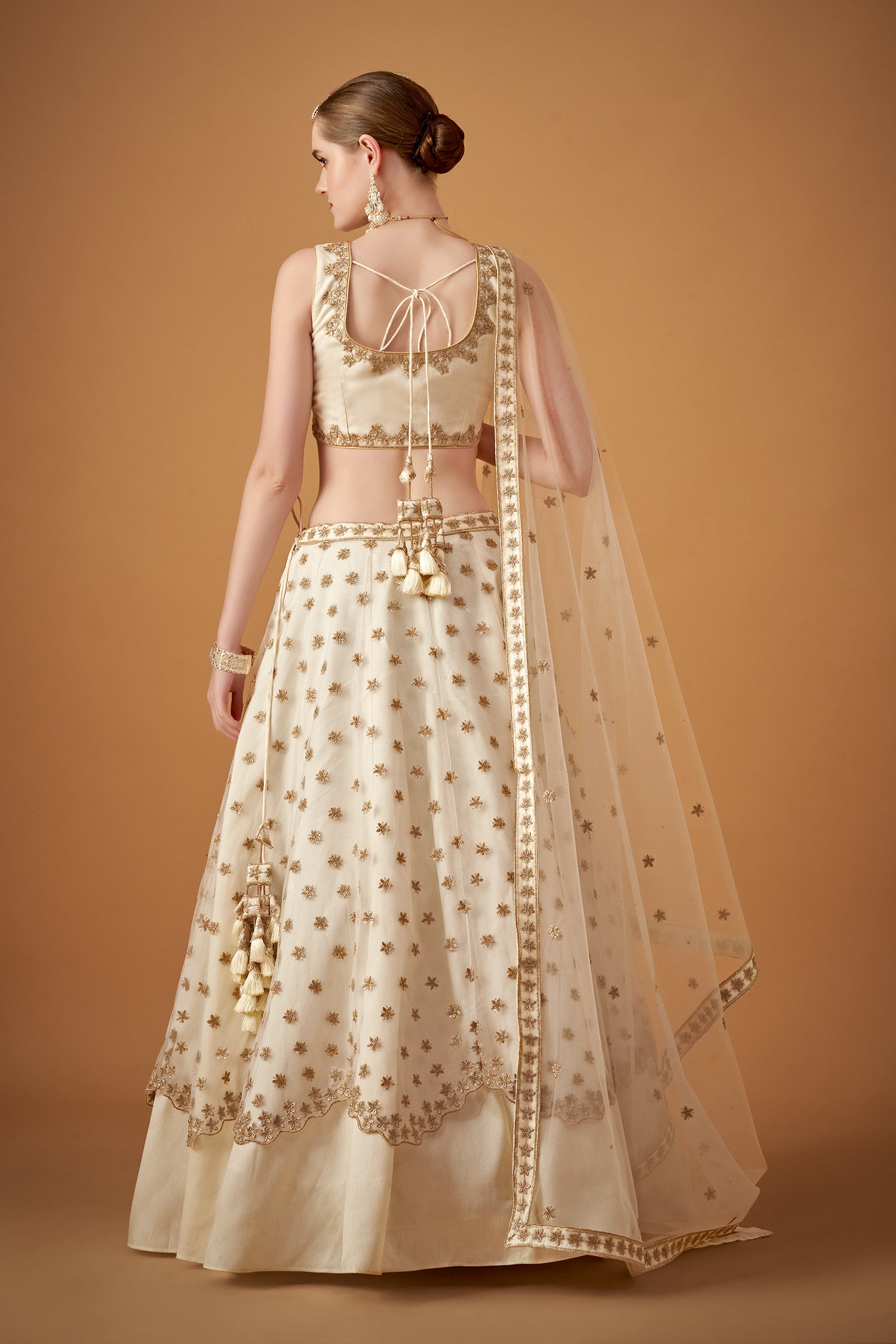 White Lehenga Set With Golden Zari Embellishments